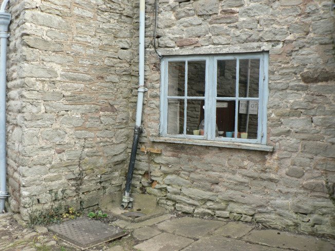 I liked the wonky drainpipe and the stone walls plus the colour blue of the worn window frame.